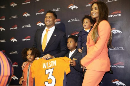 Denver Broncos new starting quarterback Russell Wilson, second from left, is joined for a photograph by his daughter Sienna, left, sons Future and Win and wife Ciara after a news conference, at the team's headquarters in Englewood, Colo
Broncos Wilson Football, Englewood, United States - 16 Mar 2022