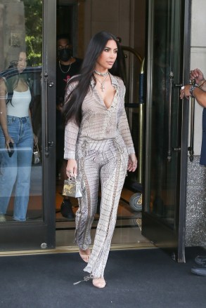New York, NY  - *EXCLUSIVE*  - Kim Kardahian sizzles in head to toe snakeskin as reality star is spotted on surprise trip to NYC. Kim was spotted leaving her hotel and heading to Milo's for lunch with her assistant Tracy and her security guard. The 40 year old cut a stylish figure in a snakeskin print outfit by Cavalli Archive and jewelry from Chrome Hearts. *Shot on July 15, 2021*Pictured: Kim KardahianBACKGRID USA 17 JULY 2021 USA: +1 310 798 9111 / usasales@backgrid.comUK: +44 208 344 2007 / uksales@backgrid.com*UK Clients - Pictures Containing ChildrenPlease Pixelate Face Prior To Publication*
