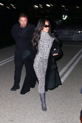 Inglewood, CA  - *EXCLUSIVE*  - Reality star Kim Kardashian is hard to miss in a shimmering catsuit while attending singer SZA’s show at the The Kia Forum in Inglewood with her assistant. Recently Kim posted a photo of Sza in the new ad campaign for her line of body shapers. The award-winning songstress appears in the latest campaign for Skims wearing pieces from the brand's Fits Everybody collection. 

Kim was seen wearing a grey catsuit, long coat, grey boots and sunglasses as she arrived to the venue on Wednesday night

Pictured: Kim Kardashian

BACKGRID USA 23 MARCH 2023 

BYLINE MUST READ: ALEXJR / BACKGRID

USA: +1 310 798 9111 / usasales@backgrid.com

UK: +44 208 344 2007 / uksales@backgrid.com

*UK Clients - Pictures Containing Children
Please Pixelate Face Prior To Publication*