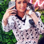 Paris Hilton Cuddles Up To Some Kittens While Doing A Photo Shoot At Crumbs And Whiskers Along Melrose Avenue In West Hollywood, CA