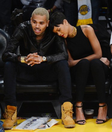©2012 GAMEPIKS 310-828-3445Singers Rihanna and Chris Brown sit courtside as they attend the Los Angeles Lakers vs. New York Knicks NBA game at Staples Center in Los Angeles on December 25, 2012. The Lakers defeated the Knicks 100-94.XYZ (Mega Agency TagID: MEGAR99084_10.jpg) [Photo via Mega Agency]