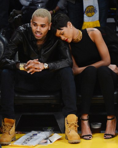©2012 GAMEPIKS 310-828-3445  Singers Rihanna and Chris Brown sit courtside as they attend the Los Angeles Lakers vs. New York Knicks NBA game at Staples Center in Los Angeles on December 25, 2012. The Lakers defeated the Knicks 100-94.  XYZ (Mega Agency TagID: MEGAR99084_10.jpg) [Photo via Mega Agency]