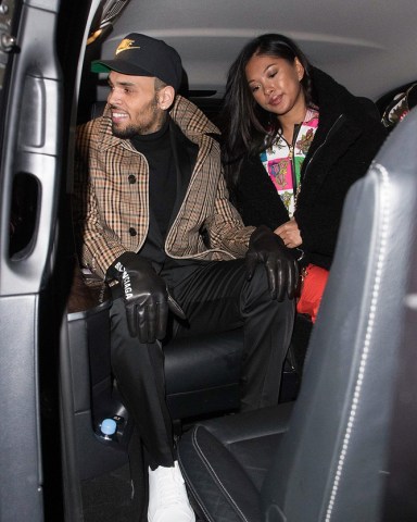 ** RIGHTS: ONLY UNITED STATES, AUSTRALIA, CANADA, NEW ZEALAND ** Paris, FRANCE  - *EXCLUSIVE*  - Singer Chris Brown appears in good spirits after being released Tuesday from police custody after a woman filed a rape complaint against him. Brown is pictured getting in a van with his girlfriend Ammika Harris at his hotel in Paris.  Pictured: Chris Brown, Ammika Harris  BACKGRID USA 23 JANUARY 2019   BYLINE MUST READ: Best Image / BACKGRID  USA: +1 310 798 9111 / usasales@backgrid.com  UK: +44 208 344 2007 / uksales@backgrid.com  *UK Clients - Pictures Containing Children Please Pixelate Face Prior To Publication*