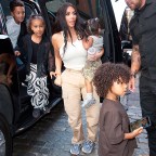 Kim Kardashian takes her kids North West, Saint West, Psalm West, and Chicago West back to their hotel in New York.