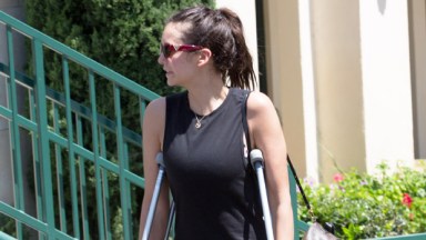 Nina Dobrev on crutches