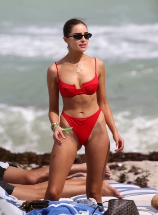 Olivia Culpo stands out in a red bikini as she hits the beach with model Devon Windsor in Miami. 28 Mar 2019 Pictured: Olivia Culpo; Devon Windsor. Photo credit: MEGA TheMegaAgency.com +1 888 505 6342 (Mega Agency TagID: MEGA389712_001.jpg) [Photo via Mega Agency]