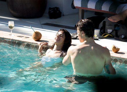 Shawn Mendes and Camila Cabello are seen during fun packed afternoon in Miami. The love birds were seen kissing while taking a swim as Shawn Mendes his water, Manuel Mendes looked down from a restaurant. Shawn Mendes who has had a off day from his busy tour used the day to take his girlfriend Camila Cabello to the beach and some pool time in Miami for a fun filled day. Camila Cabello had a very revealing white bathing suit on .The two were seen getting close to each other during a cool down in the ocean. Shawn Mendes had some bruises on his back.Pictured: Camila Cabello,Shawn MendesRef: SPL5106599 290719 NON-EXCLUSIVEPicture by: SplashNews.comSplash News and PicturesLos Angeles: 310-821-2666New York: 212-619-2666London: 0207 644 7656Milan: +39 02 56567623photodesk@splashnews.comWorld Rights