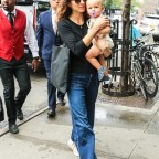 Troian Bellisario arriving at her hotel with her baby girl