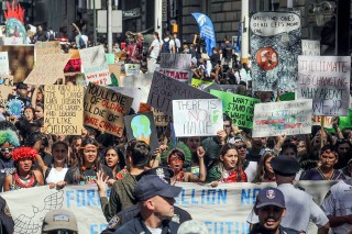 Indigenous youngsters hold a banner while leading climate change activists, during an environmental demonstration as part of a global youth-led day of action, in New York
Climate Strike, New York, USA - 20 Sep 2019