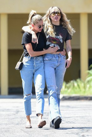 ** RIGHTS: ONLY UNITED STATES, BRAZIL, CANADA ** Los Angeles, CA  - Miley Cyrus and girlfriend Kaitlynn Carter enjoy a walk together after grabbing lunch. The couple cuts a casual figure with Kaitlynn in a black tee and jeans while Miley rocks a Metallica T-Shirt and jeans for their outing.Pictured: Kaitlynn Carter, Miley CyrusBACKGRID USA 14 SEPTEMBER 2019 USA: +1 310 798 9111 / usasales@backgrid.comUK: +44 208 344 2007 / uksales@backgrid.com*UK Clients - Pictures Containing ChildrenPlease Pixelate Face Prior To Publication*