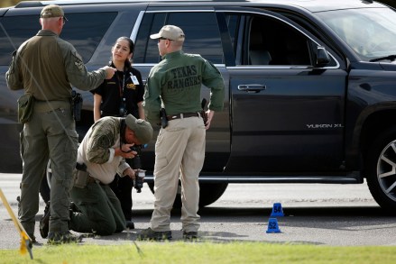 Law enforcement officials process a scene involved in Saturday's shooting, in Odessa, Texas. The death toll in the West Texas shooting rampage increased Sunday as authorities investigated why a man stopped by state troopers for failing to signal a left turn opened fire on them and fled, shooting more than a dozen people as he drove before being killed by officers outside a movie theater
Shooting Texas, Odessa, USA - 01 Sep 2019