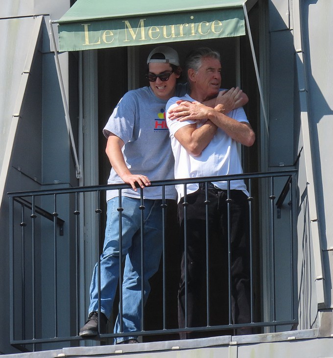 Pierce & Paris Brosnan on a balcony