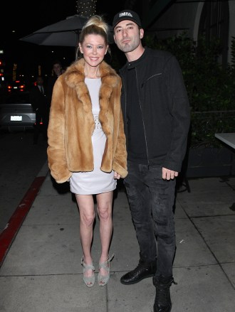 Tara Reid and her boyfriend dine at Italian restaurant Madeo in Beverly Hills. Tara is wearing a brown fur coat and a white dress underneath. The couple were in a joyous after having a romantic dinner date. 23 May 2019 Pictured: Tara Reid. Photo credit: Photographer Group/MEGA TheMegaAgency.com +1 888 505 6342 (Mega Agency TagID: MEGA428423_001.jpg) [Photo via Mega Agency]