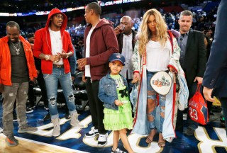 Beyonce holds the hand of her daughter Blue Ivy Carter, while her husband, rapper Jay Z, talks in the background, after the NBA All-Star basketball game in New Orleans, Sunday, Feb. 19, 2017. (AP Photo/Max Becherer)
