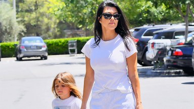 Kourtney Kardashian holding hands with son Reign Disick