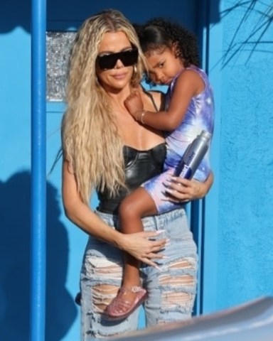 Los Angeles, CA - *EXCLUSIVE* - Khloe Kardashian dresses sexy as she meets with her daughter True for gymnastic class wearing a revealing black top with distressed denim and heels.Pictured: Khloe KardashianBACKGRID USA 8 APRIL 2022 USA: +1 310 798 9111 / usasales@backgrid.comUK: +44 208 344 2007 / uksales@backgrid.com*UK Clients - Pictures Containing ChildrenPlease Pixelate Face Prior To Publication*