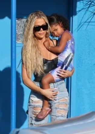 Los Angeles, CA - *EXCLUSIVE* - Khloe Kardashian dresses sexy to meet her daughter Right to gym class, wearing a revealing black shirt with heels and distressed denim.  usasales@backgrid.comUK: +44 208 344 2007 / uksales@backgrid.com*UK Customers - Pictures with Children Please clarify faces before publishing *