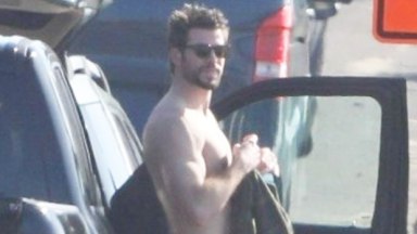 Liam Hemsworth surfing