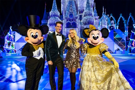 THE WONDERFUL WORLD OF DISNEY: MAGICAL HOLIDAY CELEBRATION - Matthew Morrison and Emma Bunton pose with Mickey Mouse and Minnie Mouse while hosting “The Wonderful World of Disney: Magical Holiday Celebration” at Magic Kingdom Park in Lake Buena Vista, Fla. The two-hour star-studded special airs Thursday, Nov. 28, at 8 p.m. EST on ABC and on the ABC app. (Matt Stroshane/Disneyland Resort)MINNIE MOUSE, MATTHEW MORRISON, EMMA BUNTON, MICKEY MOUSE