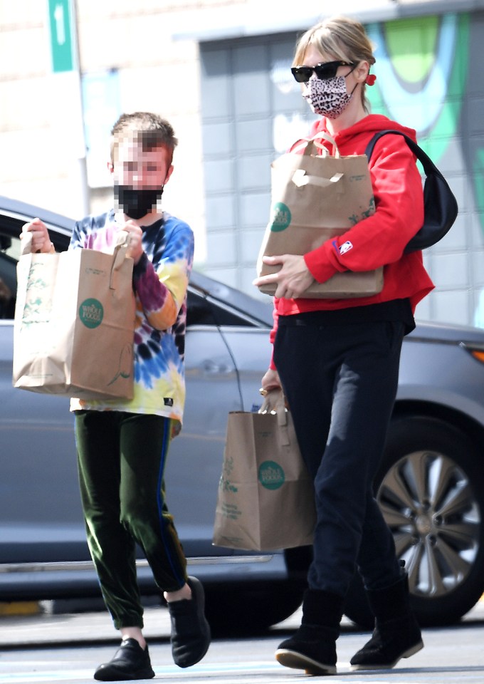 Rarely seen January Jones shops for groceries with Xander