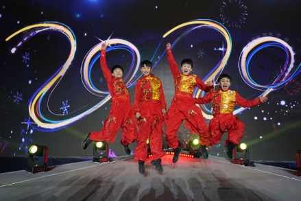 Entertainers pose for photo at the countdown event to celebrate the arrival of 2020 during the New Year's Eve celebration at Shougang Industrial Park in Beijing, China, 31 December 2019.
New Year's Eve celebration in Beijing, China - 01 Jan 2020