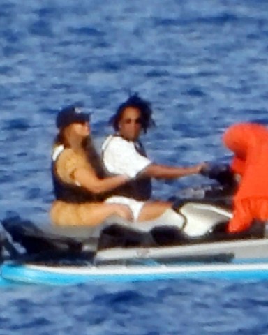 Antibes, FRANCE  - *EXCLUSIVE*  -  Superstar celebrity couple Beyonce and Jay-Z take to the waters during their sunshine holiday break at Cote d'azur, France.The legendary Hip Hop Rapper Jay-Z was behind the controls of the jet ski, as he took his wife, the 'Crazy In Love', R&B's multi award winning singer Beyonce out for a thrill seeking ride on the French waters as the couple continued their European adventure in the French sunshine.Pictured: Beyonce, Jay-ZBACKGRID USA 14 SEPTEMBER 2021 BYLINE MUST READ: MLpictures / BACKGRIDUSA: +1 310 798 9111 / usasales@backgrid.comUK: +44 208 344 2007 / uksales@backgrid.com*UK Clients - Pictures Containing ChildrenPlease Pixelate Face Prior To Publication*