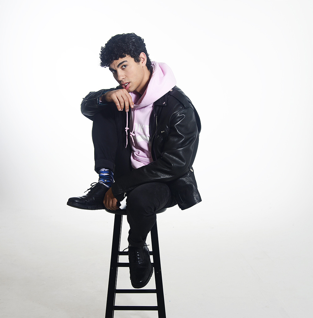 Davi Santos poses for a portrait for HollywoodLife.