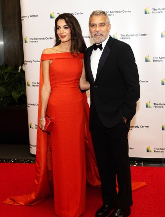 George Clooney and his wife, Amal arrive for the formal Artist's Dinner honoring the recipients of the 45th Annual Kennedy Center Honors at the Department of State in Washington, DC on Saturday, December 3, 2022. The 2022 honorees are: actor and filmmaker George Clooney ;  contemporary Christian and pop singer-songwriter Amy Grant;  legendary singer of soul, gospel, R&B, and pop Gladys Knight;  Cuban-born American composer, conductor, and educator Tania Le√≥n;  and iconic Irish rock band U2, comprised of band members Bono, The Edge, Adam Clayton, and Larry Mullen Jr.  Credit: Ron Sachs / Pool via CNP Pictured: George Clooney,Amal Clooney Ref: SPL5507657 031222 NON-EXCLUSIVE Picture by: Ron Sachs/CNP / SplashNews.com Splash News and Pictures USA: +1 310-525-5808 London: +44 (0)20 8126 1009 Berlin: +49 175 3764 166 photodesk@splashnews.com World Rights, No France Rights