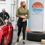 *EXCLUSIVE* Jennifer Lopez wears custom leggings with her kid's names on it on way to gym after a mobile COVID-19 test van exiting was seen exiting her home.