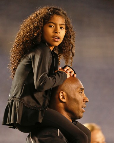 Gianna Bryant sits on the shoulders of her father, Kobe Bryant, as they attend the women's soccer match between the United States and China, in San DiegoChina USA Women soccer, San Diego, USA