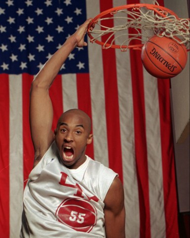 KOBE BRYANT With a large flag as a backdrop, Kobe Bryant dunks the ball at his Lower Merion, Pa. high school gym during a practice . The 6-foot 6 suburban Philadelphia phenom can play for any college in the nation or he may jump right from high school to pro basketball
KOBE'S QUANDARY, LOWER MERION, USA