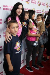 Nadya Suleman with her children
'Octomom' Nadya Suleman takes her children out to design her own milkshake, West Hollywood, Los Angeles, America  - 10 Nov 2010
A very slim looking Nadya, dressed in a bright pink Millions Of Milkshakes T-shirt, then set about designing her ultimate signature shake which included bananas, berries, sugar free cocoa, protein powder and dairy free cream.
The shake is now officially on the menu at the store. She is likely to be an expert when it comes to all things milk related. So Octomom Nadya Suleman is the perfect candidate to design her own milkshake flavor.