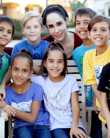 EXCLUSIVE: Natalie 'Octomom' Suleman cooks up a family meal for her 8 children, the only surviving Octuplets in the world, now 8 years-old at their home in Laguna Niguel,California. The family posed for some fun photos together before sitting down to a vegan dinner in the apartment they share with Sulemans other six children. Suleman talked about turning her back on the Octomom stigma and finally finding peace after contemplating suicide due to the stress of raising such a large family. The Octuplets, Makai, Josiah, Isaiah, Jonah, Maliyah, Jeremiah, Nariyah and Noah turn 9 in January. 11 Dec 2017 Pictured: Octomom, Natalie Suleman. Photo credit: MOVI Inc. / MEGA TheMegaAgency.com +1 888 505 6342 (Mega Agency TagID: MEGA147234_002.jpg) [Photo via Mega Agency]