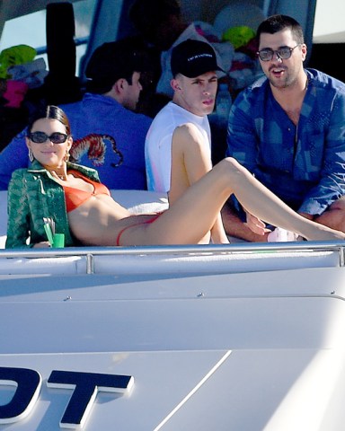 Kendall Jenner wears an orange bikini during a boat ride in Miami Beach,Florida.Kendall had lunch and later read a book.  Pictured: Kendall Jenner Ref: SPL5134058 061219 NON-EXCLUSIVE Picture by: Robert O'Neil / SplashNews.com  Splash News and Pictures Los Angeles: 310-821-2666 New York: 212-619-2666 London: +44 (0)20 7644 7656 Berlin: +49 175 3764 166 photodesk@splashnews.com  World Rights