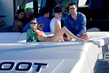 Kendall Jenner wears an orange bikini during a boat ride in Miami Beach,Florida.Kendall had lunch and later read a book.Pictured: Kendall JennerRef: SPL5134058 061219 NON-EXCLUSIVEPicture by: Robert O'Neil / SplashNews.comSplash News and PicturesLos Angeles: 310-821-2666New York: 212-619-2666London: +44 (0)20 7644 7656Berlin: +49 175 3764 166photodesk@splashnews.comWorld Rights