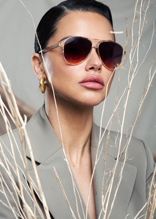 Adriana Lima stops by HollywoodLife.com to model her new Privé Revaux collection.
