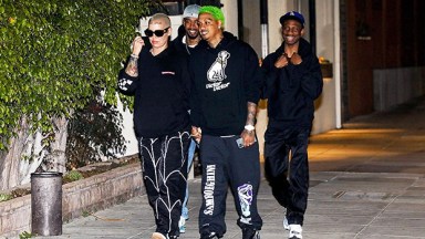 Amber Rose & A.E. holding hands while out to dinner