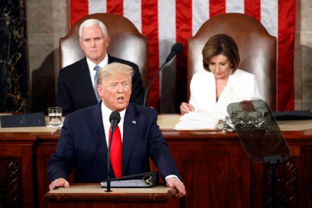 President Donald Trump delivers his State of the Union address to a joint session of Congress on Capitol Hill in Washington, Tuesday, Feb. 4, 2020, as Vice President Mike Pence and House Speaker Nancy Pelosi, D-Calif., watch. (AP Photo/Patrick Semansky)