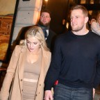 JJ Wattholds on to fiance Kealia Ohai and a Guiness as he is seen at the SNL afterparty after hosting the show