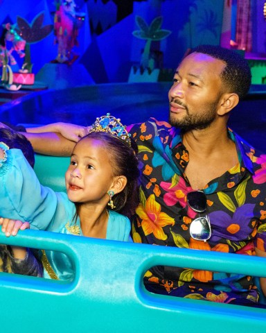 Chrissy Teigen, John Legend and their kids, Luna and Miles, enjoy a whimsical voyage on 'it's a small world' at Disneyland Park in Anaheim, Calif., April 14, 2022, complete with a cast of nearly 300 audio-animatronics dolls representing children from every corner of the globe singing the classic anthem.
Chrissy Teigen and John Legend celebrate Daughter Luna's Birthday at Disneyland Resort, Anaheim, California, USA - 14 Apr 2022