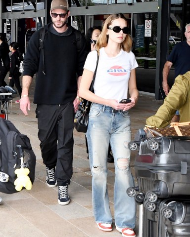 Sydney, AUSTRALIA  - *EXCLUSIVE*  - Liam Hemsworth and Gabriella Brooks arrive back in Australia from spending time in LA.Pictured: Liam Hemsworth, Gabriella Brooks.BACKGRID USA 7 FEBRUARY 2023 BYLINE MUST READ: Chris Dyson / BACKGRIDUSA: +1 310 798 9111 / usasales@backgrid.comUK: +44 208 344 2007 / uksales@backgrid.com*UK Clients - Pictures Containing ChildrenPlease Pixelate Face Prior To Publication*