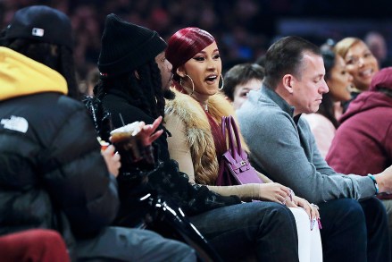 Cardi B and Offset are seen during the first half of the NBA All-Star basketball game Sunday, Feb. 16, 2020, in Chicago. (AP Photo/Nam Huh)