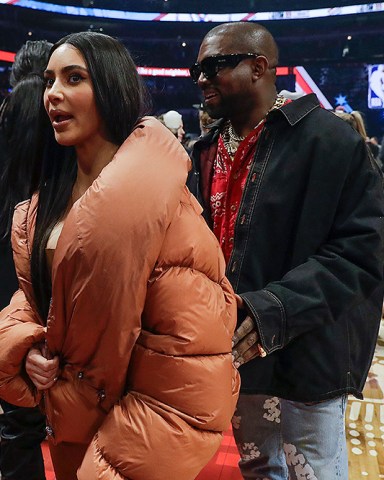 Kim Kardashian and Kanye West are seen during halftime of the NBA All-Star basketball game Sunday, Feb. 16, 2020, in Chicago. (AP Photo/Nam Huh)