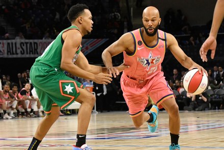 Team Wilbon's Common, right, is defended by Team Stephen A's Chance The Rapper during the first half of the NBA Celebrity All-Star basketball game Friday, Feb. 14, 2020, in Chicago. (AP Photo/David Banks)