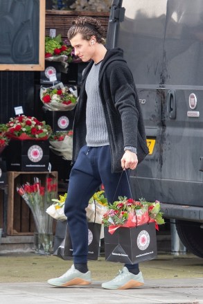 London, UNITED KINGDOM  - *EXCLUSIVE*  Heartthrob Shawn Mendes shows his love for Camila Cabello by buying armfuls of flowers at an outdoor shop in London. Shawn handpicked the flowers at Flower Station in North London before loading up the bouquets himself into his car. Shawn then completed his gift buying with a stop at Rococo chocolates in St Johns Wood where he spent time choosing more sweet treats for his love on their first valentines together. Shawn also made sure his lips were nice and moist ahead of his romantic night as he lathered on the lip balm!Pictured: Shawn MendesBACKGRID USA 14 FEBRUARY 2020 BYLINE MUST READ: MJ Pictures / BACKGRIDUSA: +1 310 798 9111 / usasales@backgrid.comUK: +44 208 344 2007 / uksales@backgrid.com*UK Clients - Pictures Containing ChildrenPlease Pixelate Face Prior To Publication*
