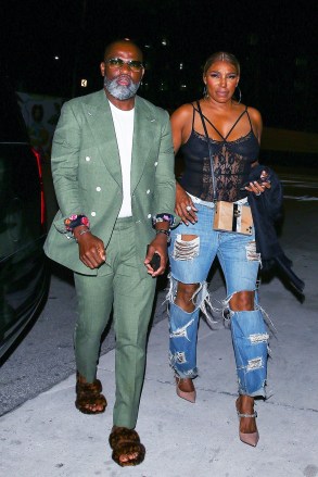 Miami, FL  - *EXCLUSIVE- NeNe Leakes and her boyfriend Nyonisela Sioh were seen arriving at Bar One restaurant for a dinner in Miami, Florida. NeNe looks casually chic in a lace body suit and baggy ripped jeans paired with heels.

Pictured: NeNe Leakes, Nyonisela Sioh

BACKGRID USA 9 MAY 2022 

USA: +1 310 798 9111 / usasales@backgrid.com

UK: +44 208 344 2007 / uksales@backgrid.com

*UK Clients - Pictures Containing Children
Please Pixelate Face Prior To Publication*