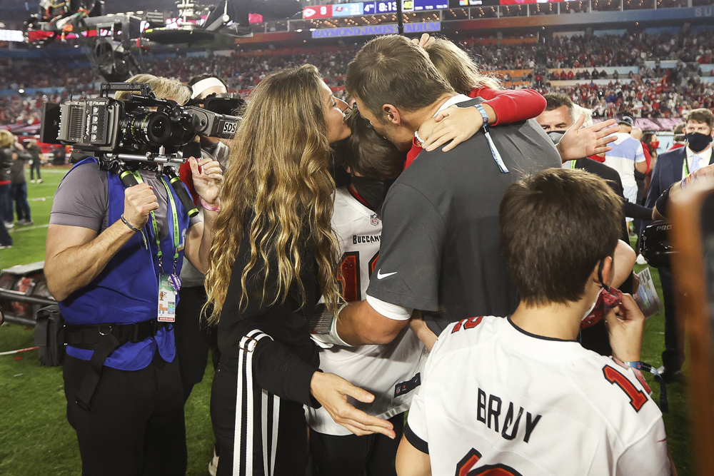 Tampa Bay Buccaneers quarterback Tom Brady (12) celebrates with his family after the NFL Super Bowl 55 football game against the Kansas City Chiefs, Sunday, Feb. 7, 2021 at Tampa, Fla. Tampa Bay won 31-9 to win Super Bowl LV. (Ben Liebenberg via AP)
