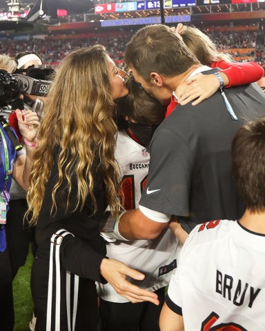 Tampa Bay Buccaneers quarterback Tom Brady (12) celebrates with his family following the NFL Super Bowl 55 football game against the Kansas City Chiefs, Sunday, Feb. 7, 2021 in Tampa, Fla. Tampa Bay won 31-9 to win Super Bowl LV. (Ben Liebenberg via AP)