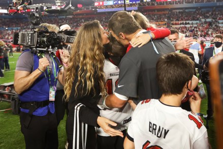Tampa Bay Buccaneers quarterback Tom Brady (12) celebrates with his family after the NFL Super Bowl 55 football game against the Kansas City Chiefs on Sunday, February 7, 2021 in Tampa, Florida.  Tampa Bay won 31–9 to win Super Bowl LV.  (Ben Liebenberg via AP)