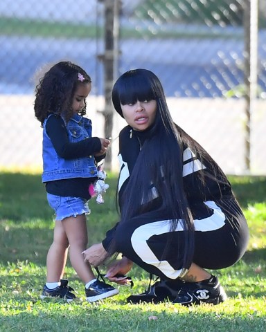 EXCLUSIVE: Blac Chyna takes her daughter Dream Kardashian to support her little brother King at his soccer game in Woodland Hills. Blac was seen arriving and spending time with a mystery man as she stood on the sidelines with the other parents. Dream Kardashian was seen having a great time running around and at one point she had a phone on her hand and she typed 911 on the calculator key pad. **SPECIAL INSTRUCTIONS*** Please pixelate children's faces before publication.**. 06 Oct 2019 Pictured: Blac Chyna, Dream Kardashian, King Stevenson. Photo credit: Marksman / MEGA TheMegaAgency.com +1 888 505 6342 (Mega Agency TagID: MEGA522163_001.jpg) [Photo via Mega Agency]